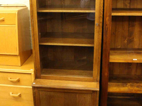 Slim oak glazed door cabinet bookcase