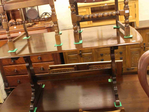 Two rectangular Ercol dining tables, set of six carved oak and studded...