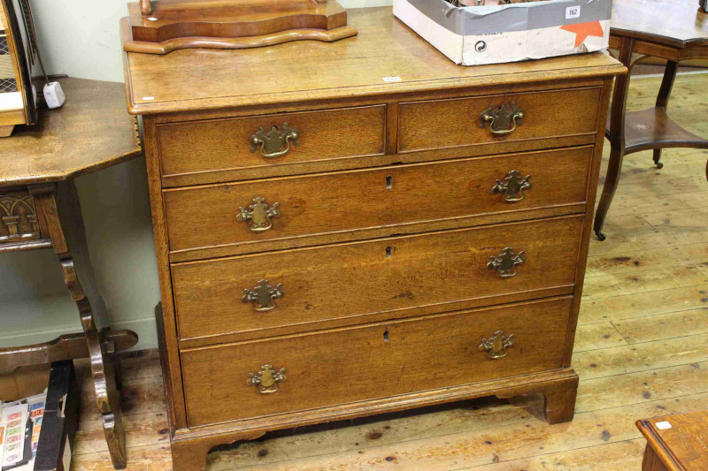 Georgian oak chest of two short above three long graduated drawers on bracket feet, 95cm by 88.5cm