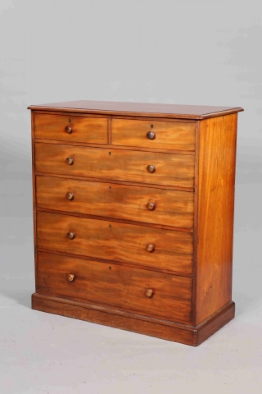 GILLOW, A MID 19TH CENTURY MAHOGANY CHEST OF DRAWERS, the moulded rectangular top above two short over four long graduated drawers, each with turned pulls, raised on a plinth base, stamped GILLOW. 122cm by 111.5cm by 54cm