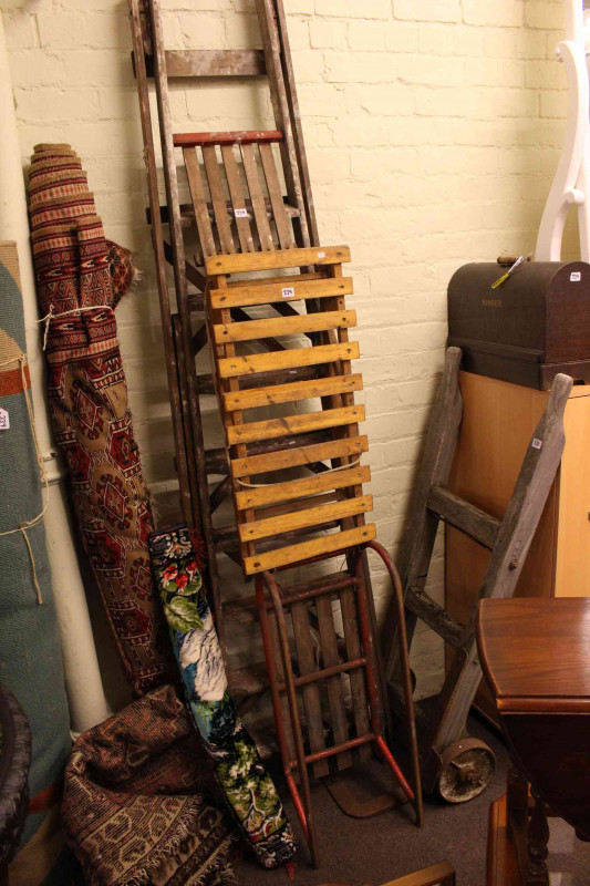 Vintage sack barrow, pair steps, Singer sewing machine, two sledges, three rugs and wall hanging (9)