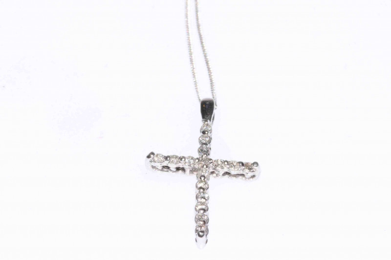 Platinum and diamond cross pendant on 18 carat gold chain