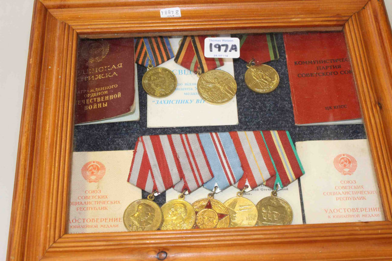 Russian medals, well presented with papers in a display case