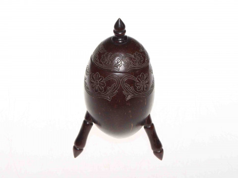 Carved coconut jar with hinged cover and three legs