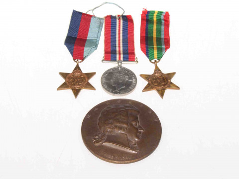 Bronze medallion, Mozart, two WWII stars and a General Service medal (4)