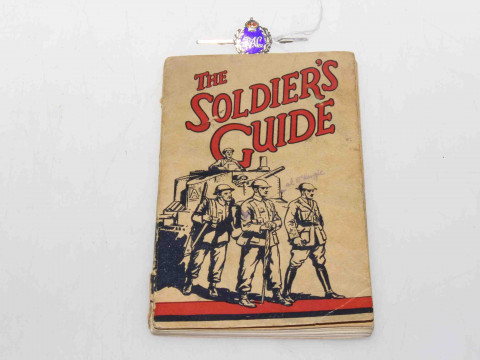 Silver and enamel RAC brooch and a soldier's guide