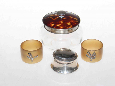 Silver box, silver mounted jar and a pair of napkin rings applied with...