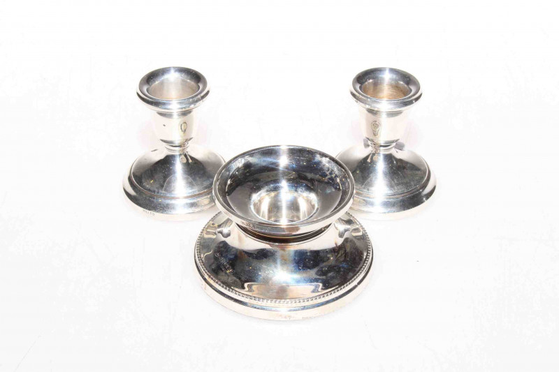 Pair of silver candlesticks and a single silver candlestick (3)