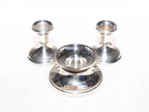 Pair of silver candlesticks and a single silver candlestick (3)