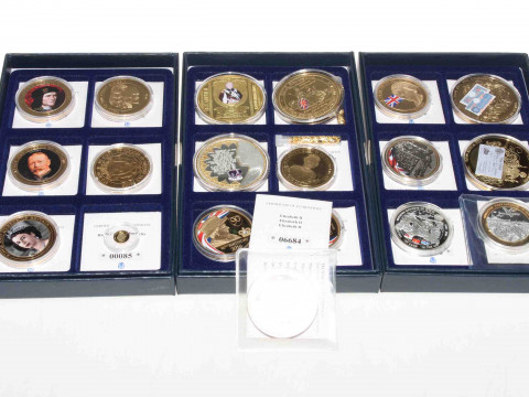 Three boxes of commemorative coins