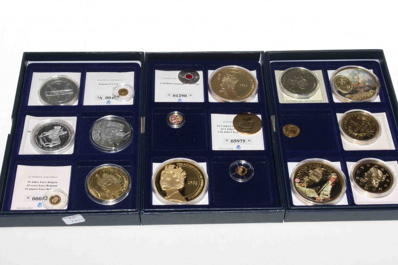 Three boxes of commemorative coins