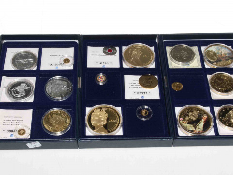 Three boxes of commemorative coins