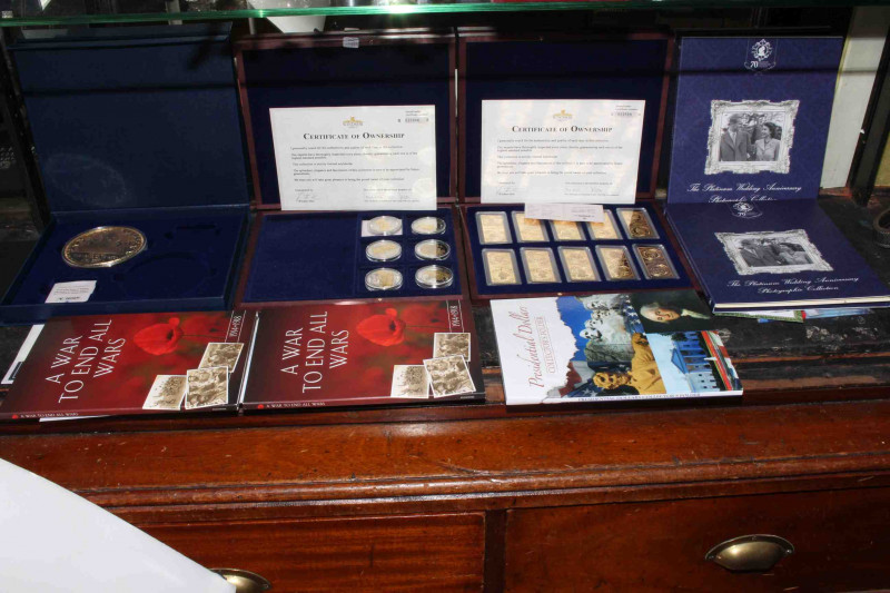 Collection of Mint coins, in albums/cases