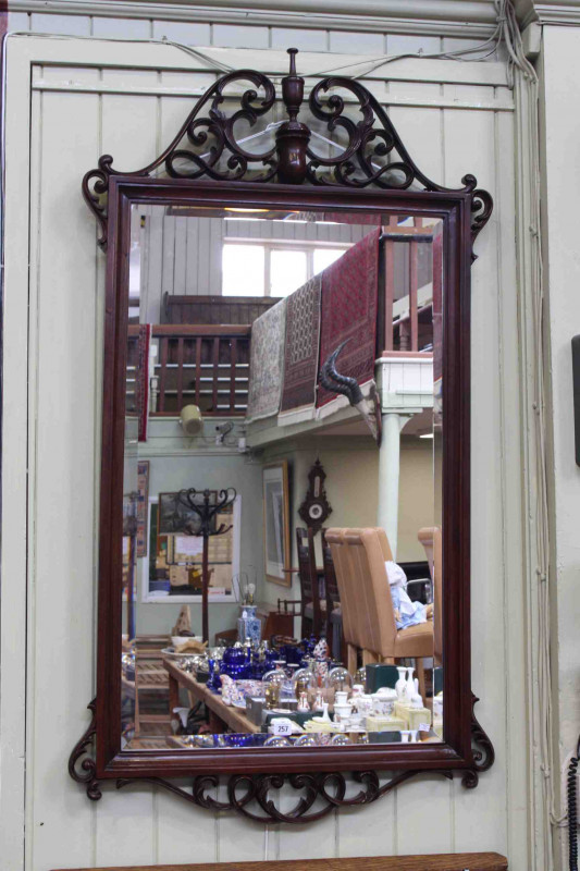 Mahogany framed rectangular bevelled wall mirror with scrolling swan neck and urn pediment, 144cm x 78cm overall