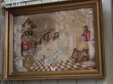 Religious silkwork in gilt glazed frame
