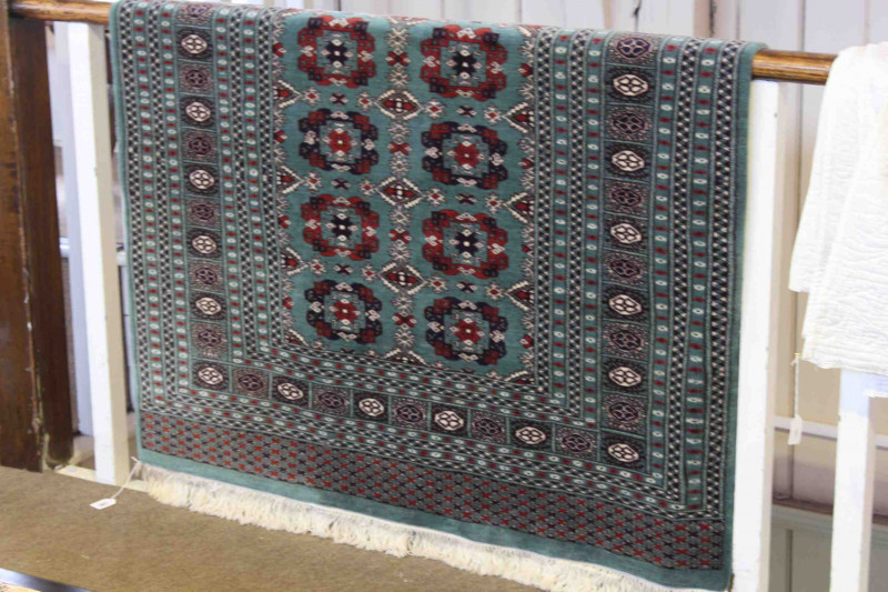 Bokhara rug with a green ground, 1.90m x 1.25m