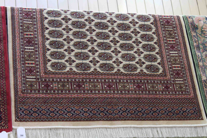 Bokhara rug with a beige ground, 1.90m x 1.40m