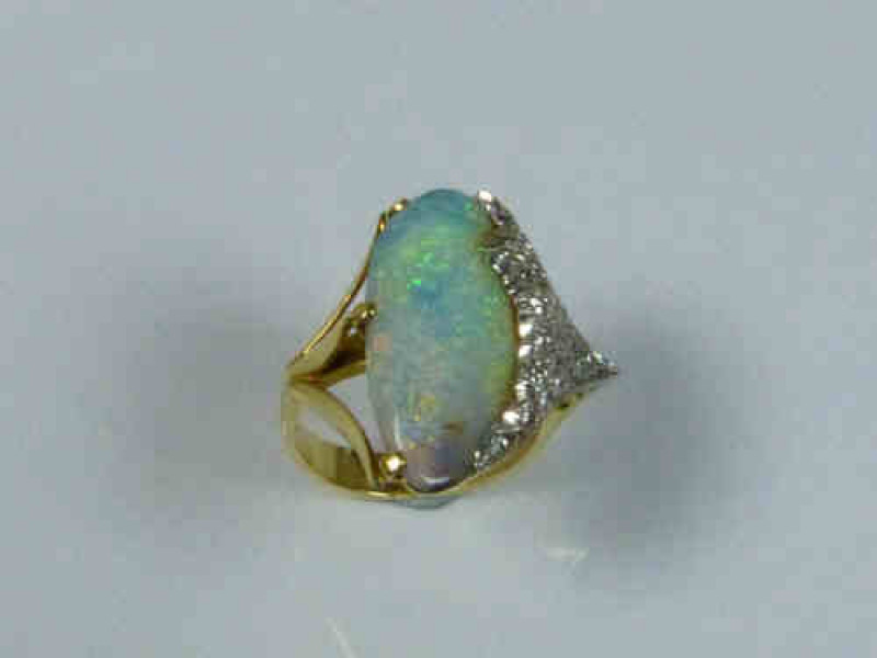 Opal and Diamond Ring with a Yellow Gold Band, Tests as 18-22 Carat, Size M 1/2