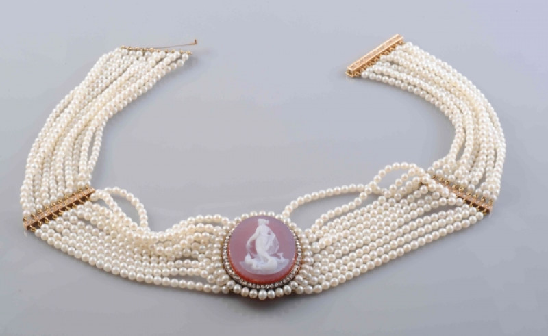 A LATE 19TH CENTURY PEARL, DIAMOND AND HARDSTONE CHOKER, the uniform pearls each strung knotted into ten graduating rows with two rectangular old cut diamond set spacers and a similarly set rectangular clasp, set to the front with an oval mount set to the