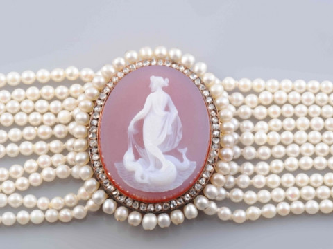 A LATE 19TH CENTURY PEARL, DIAMOND AND HARDSTONE CHOKER, the uniform pearls each strung knotted into ten graduating rows with two rectangular old cut diamond set spacers and a similarly set rectangular clasp, set to the front with an oval mount set to the thumbnail