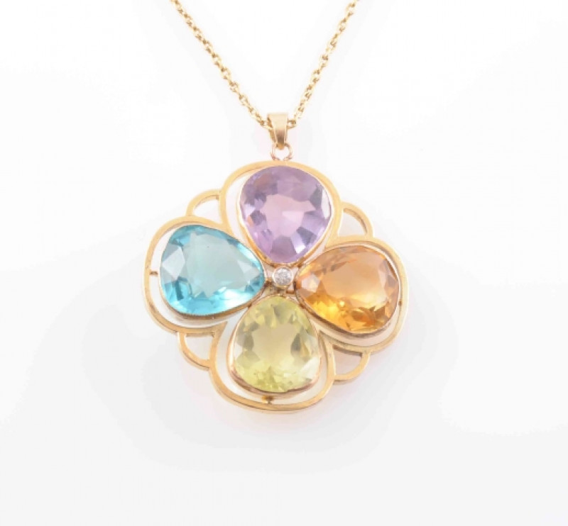 A MULTI GEM SET PENDANT, the four pear cut gem stones, to include citrine, amethyst and peridot, set to form a flowerhead shape mount between a cut out metal work border, suspending from an articulated tapering oval bale from a fine oval link chain with b