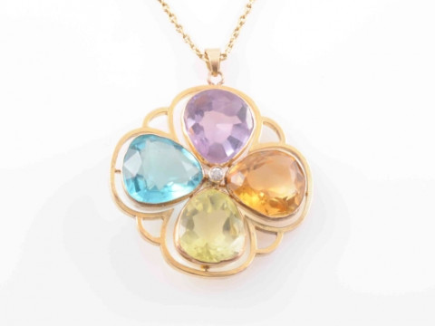 A MULTI GEM SET PENDANT, the four pear cut gem stones, to include citrine,...