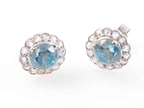 A PAIR OF BLUE ZIRCON AND DIAMOND EARRINGS, the round cut blue zircons...