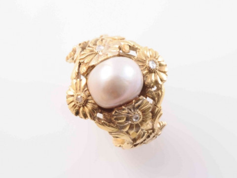 A NATURAL SALTWATER PEARL RING, the large single saltwater pearl set within...