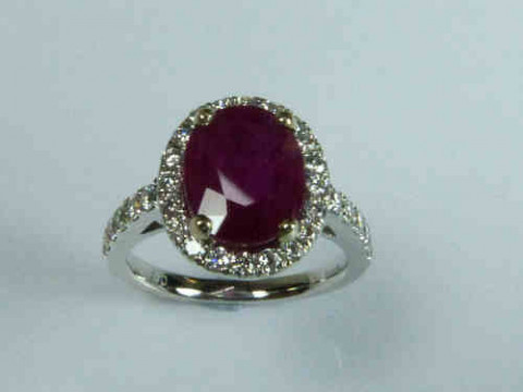 Ruby and Diamond Cluster Ring with an 18ct White Gold Band, the Ruby Estimated...