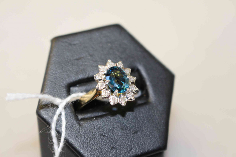 9 carat gold, blue topaz and diamond cluster ring