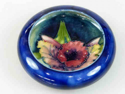 Moorcroft Dish decorated with orchid on blue ground