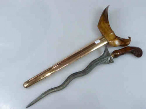 A Fine Quality Kris with watered blade and copper covered scabbard