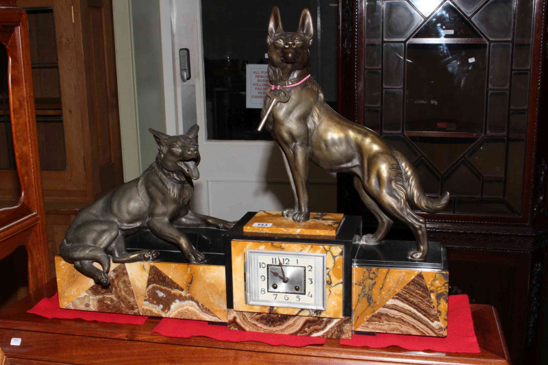 Striking marble and spelter mantel clock, surmounted by two German Shepherd dogs, in the Art Deco style