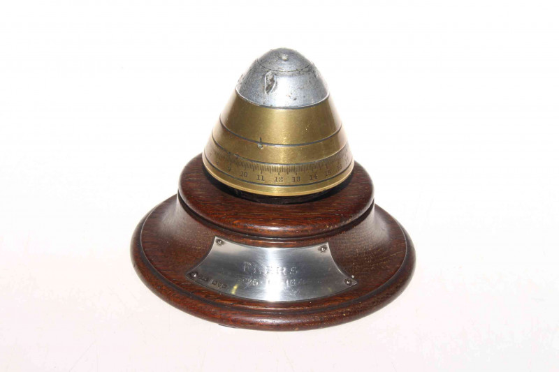 WWI German bomb timer on wood base with silver plaque, stamped FLERS 26-10-1915