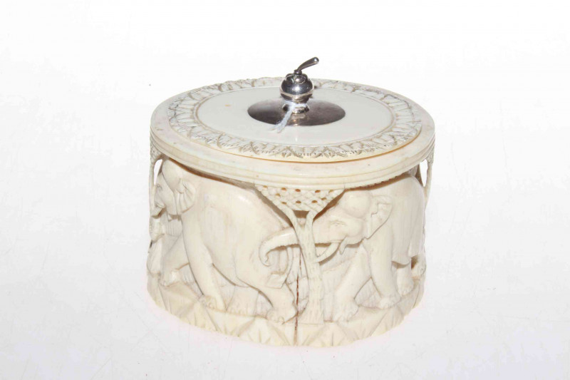 Carved ivory jar and cover, circa 1900, with white metal knop