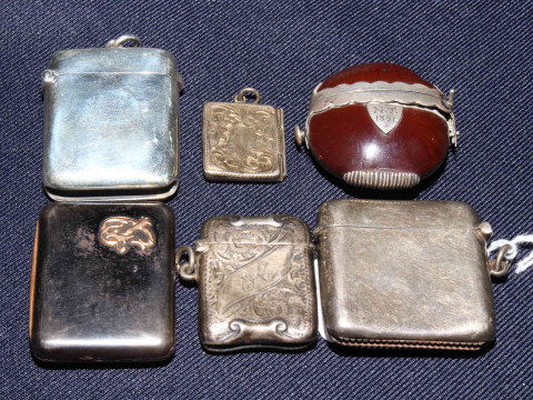 Three silver vesta cases, vesta with gold mount (unmarked), silver stamp...
