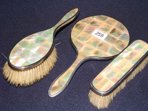 Silver and mother-of-pearl three piece dressing table set