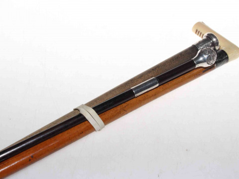 Ivory-handled cane with malacca shaft, late 19th Century; together with...