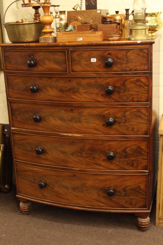 Victorian mahogany five height bow front chest on turned legs