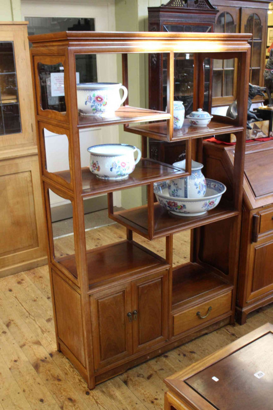 Chinese rosewood open shelf unit with numerous shelves, double door cupboard and drawer