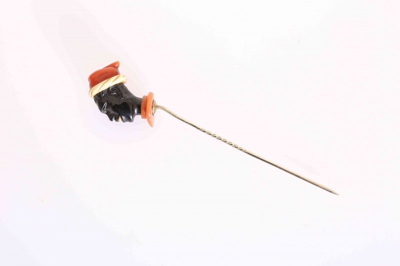 A STICK PIN FORMED AS A BLACKAMOOR'S HEAD. 8cm