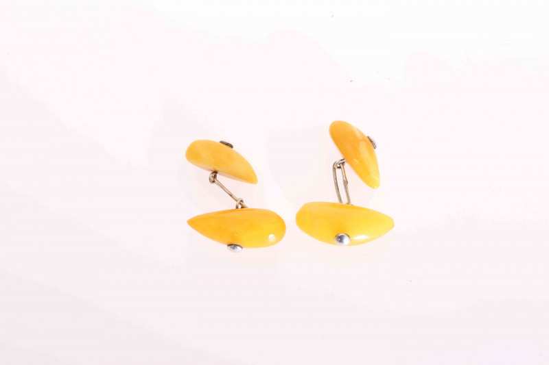 A PAIR OF RUSSIAN SILVER AND AMBER COLOURED CUFFLINKS, stamped marks including 875 and sickle and hammer.