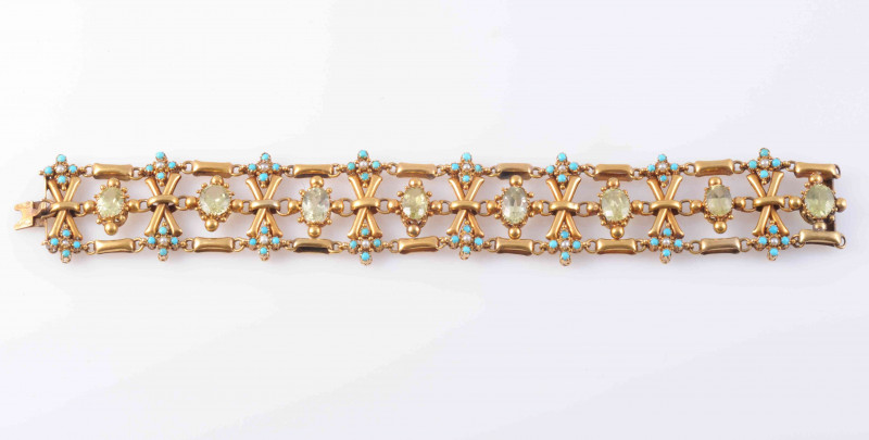 A PERIDOT, TURQUOISE AND SEED PEARL BRACELET, the eight oval cut peridot's each claw set with beaded metal details, on articulated links between cross style metal work mounts each set to the top and bottom with two subtle floral style mounts of four turqu