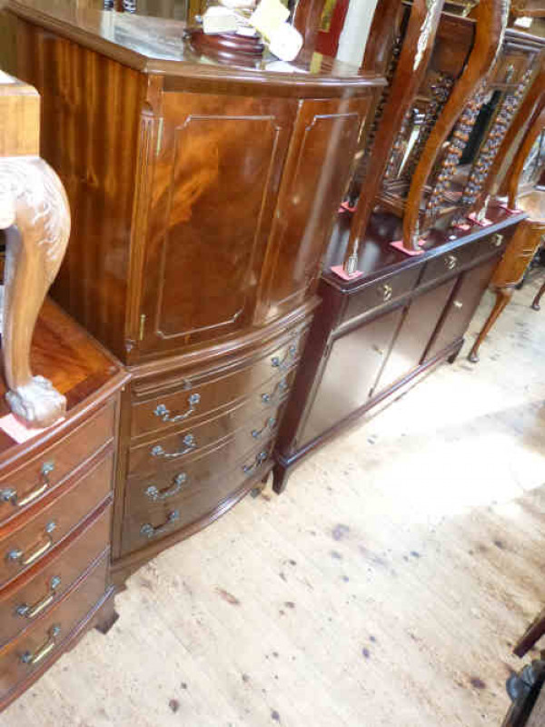 Bow Front Mahogany Tallboy Cabinet having Two Doors Above a Central Slide with a Drawer and Cupboard Below