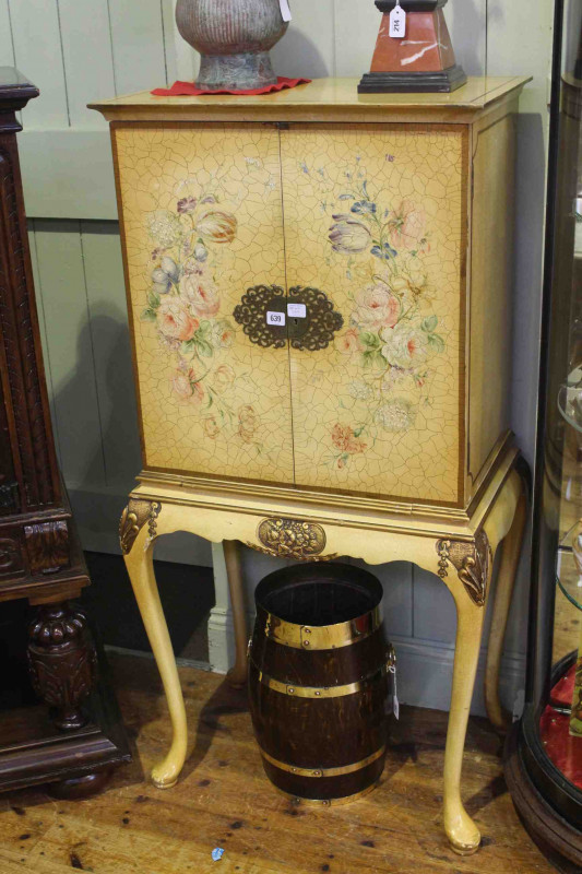 Floral painted two door cocktail cabinet on cabriole legs, 137cm x 69cm