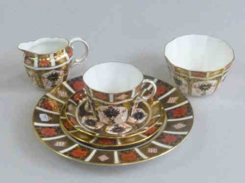 Royal Crown Derby Imari Pattern Tea Service Comprising Six Cups, Saucers, Plates, Sugar Bowl, Cream Jug and Eight 27cm Plates