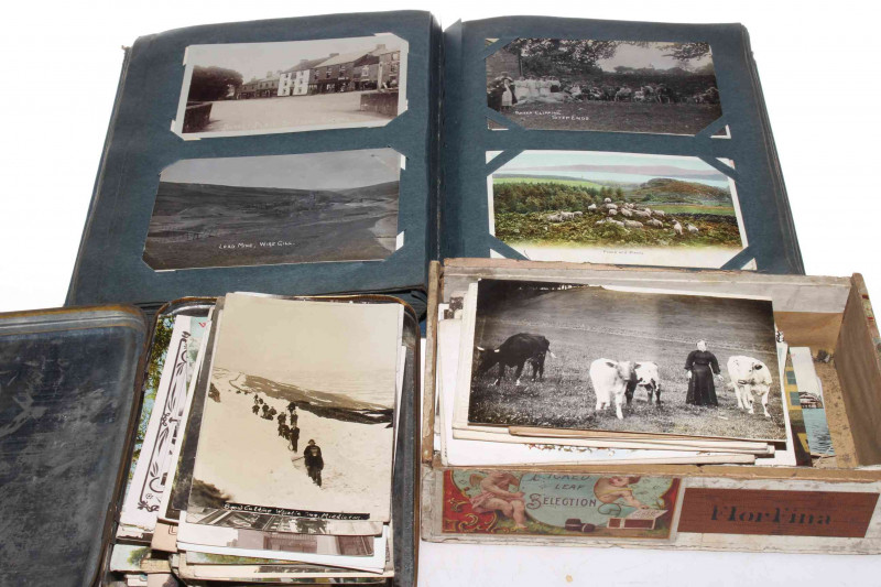Postcard album and two boxes. Depicting photographer D. Sinclair of Middleton in Teesdale, bonfire, Fair Day, New Golf Course, High Cup Nick, Old Washing Shop Little Eggleshope, Pelton Railway Station, Nurse Parade Saltburn, Foggarthwaite, Lead Mine, Wire