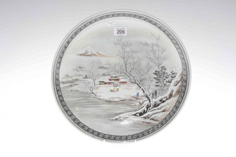 Japanese porcelain charger with winter landscape, blue character mark, 33.5cm diameter 