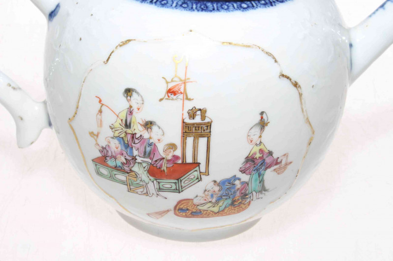 Late 18th Century Chinese porcelain teapot, tea bowl and saucer, having painted panels of happy figures interior and underglaze blue borders