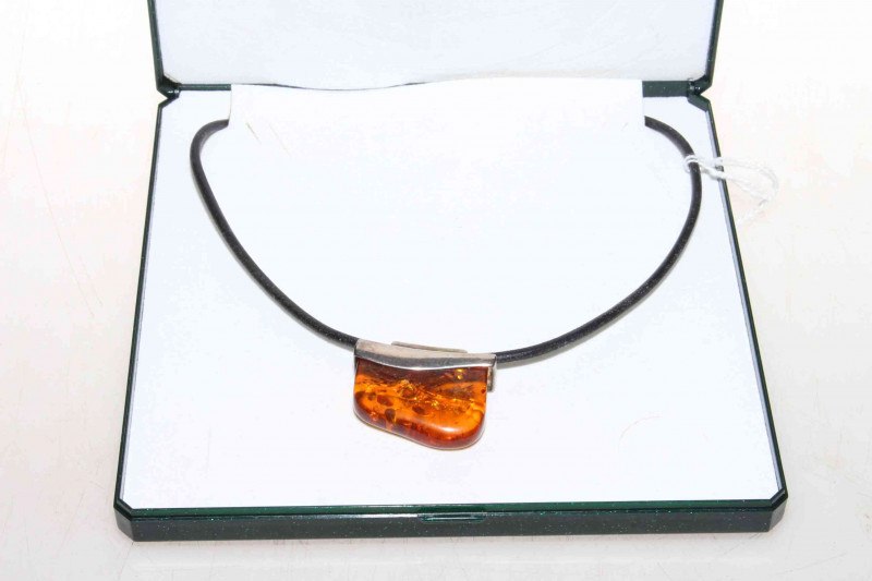 Silver mounted amber pendant, boxed